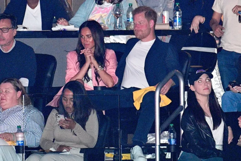 Harry and Meghan caught sharing kiss cam moments at a Basketball game
